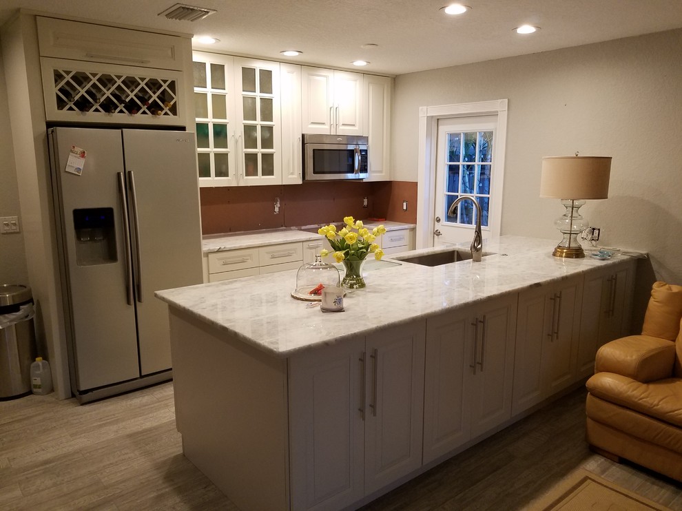 Kitchen with under granite lighting Beach Style Kitchen Other