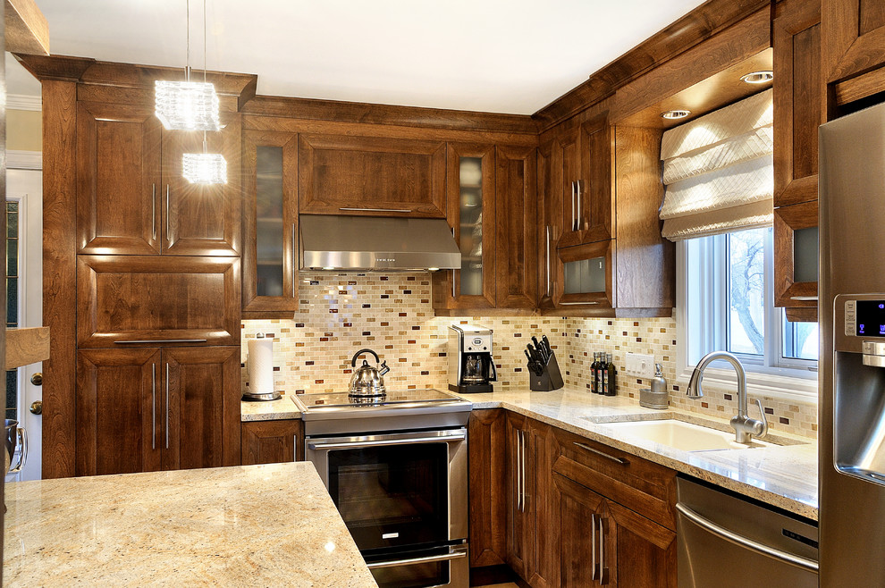 Kitchen - traditional kitchen idea in Montreal with medium tone wood cabinets
