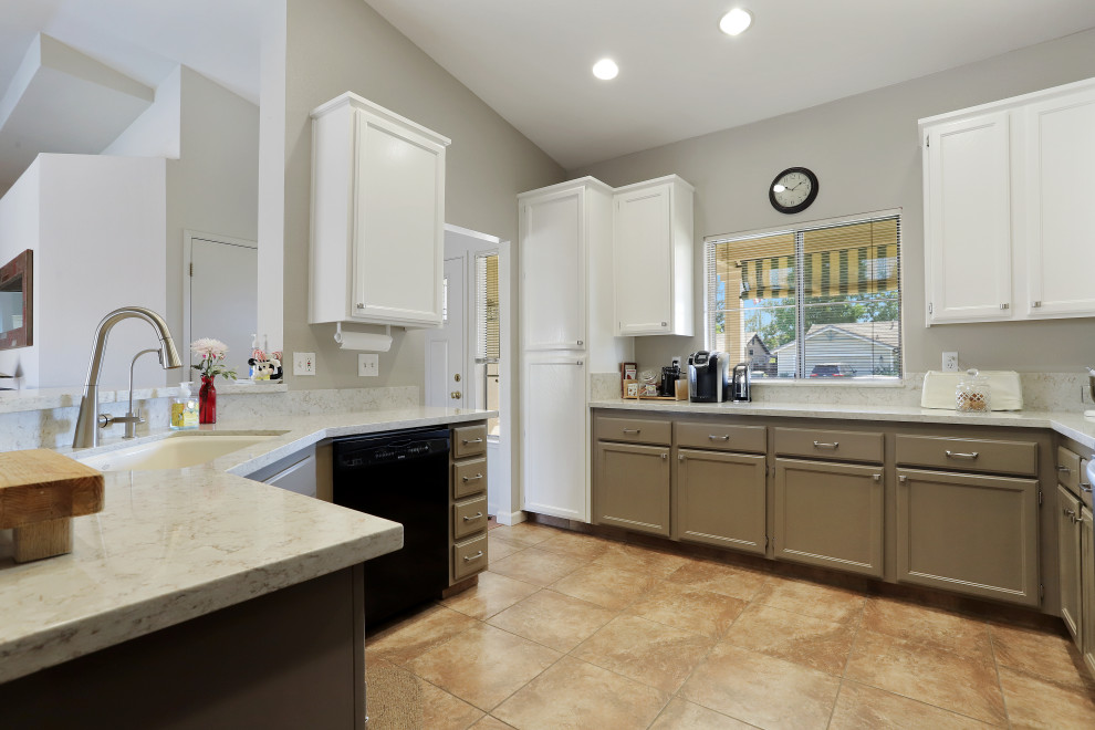 Inspiration for a modern u-shaped eat-in kitchen remodel in Sacramento with white cabinets and a peninsula