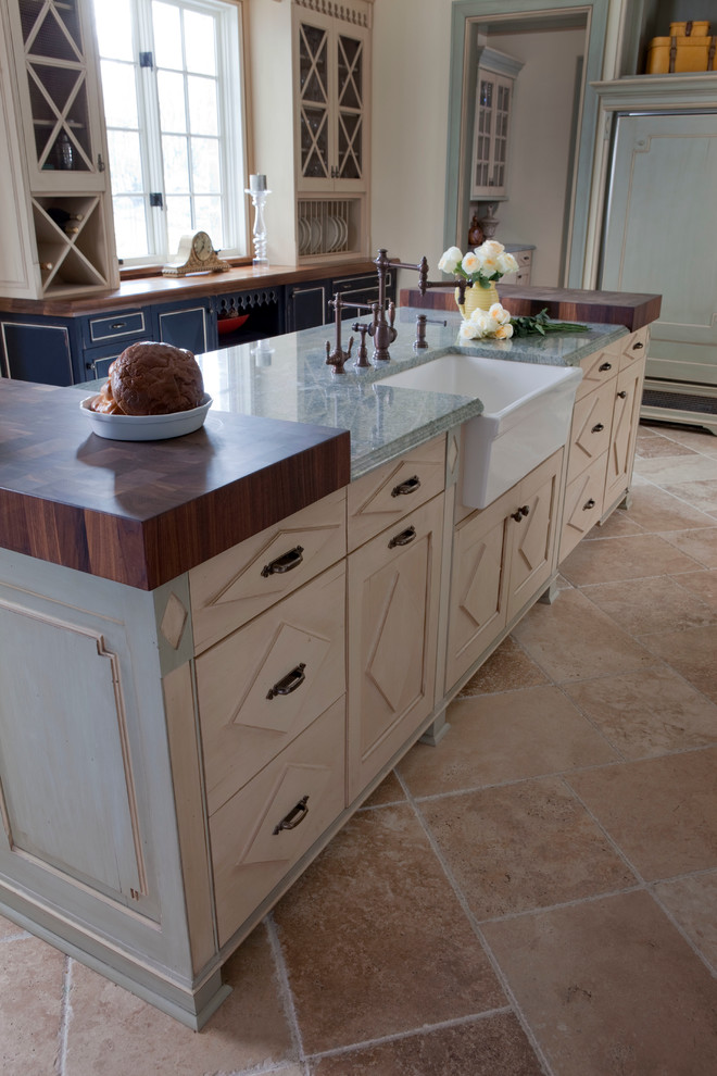 Eat-in kitchen - huge traditional u-shaped ceramic tile eat-in kitchen idea in New York with white backsplash, paneled appliances, an island, a farmhouse sink, raised-panel cabinets, distressed cabinets, granite countertops and subway tile backsplash