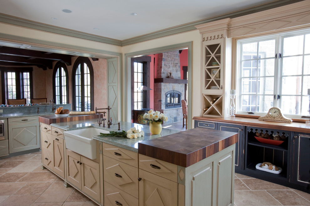 Inspiration for a huge timeless u-shaped ceramic tile eat-in kitchen remodel in New York with white backsplash, paneled appliances, an island, a farmhouse sink, raised-panel cabinets, distressed cabinets, granite countertops and subway tile backsplash
