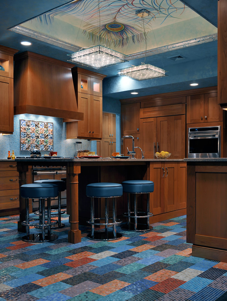 Large eclectic galley enclosed kitchen photo in New York with an undermount sink, medium tone wood cabinets, granite countertops, multicolored backsplash, stainless steel appliances and an island