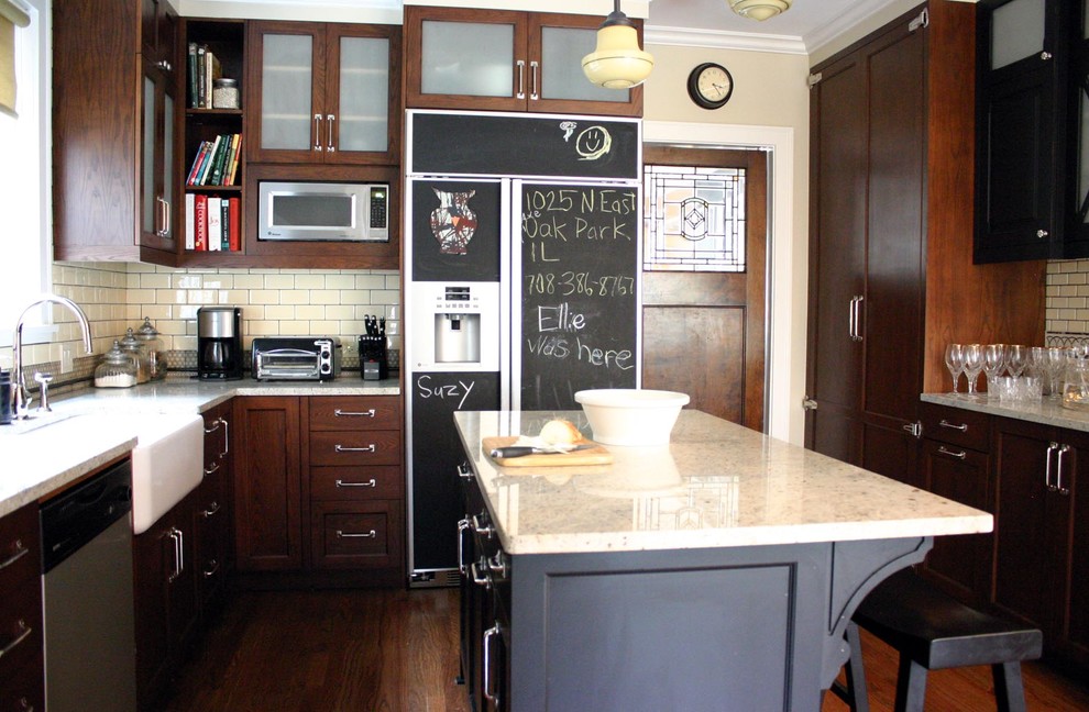 Inspiration for a timeless kitchen remodel in Chicago with subway tile backsplash, a farmhouse sink, recessed-panel cabinets, dark wood cabinets, granite countertops and beige backsplash