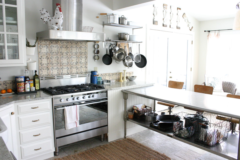 Kitchen - eclectic kitchen idea in Chicago with stainless steel appliances, white cabinets and multicolored backsplash