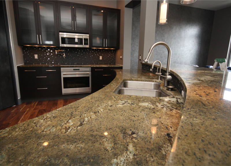 Example of a trendy kitchen design in Austin with an undermount sink and granite countertops