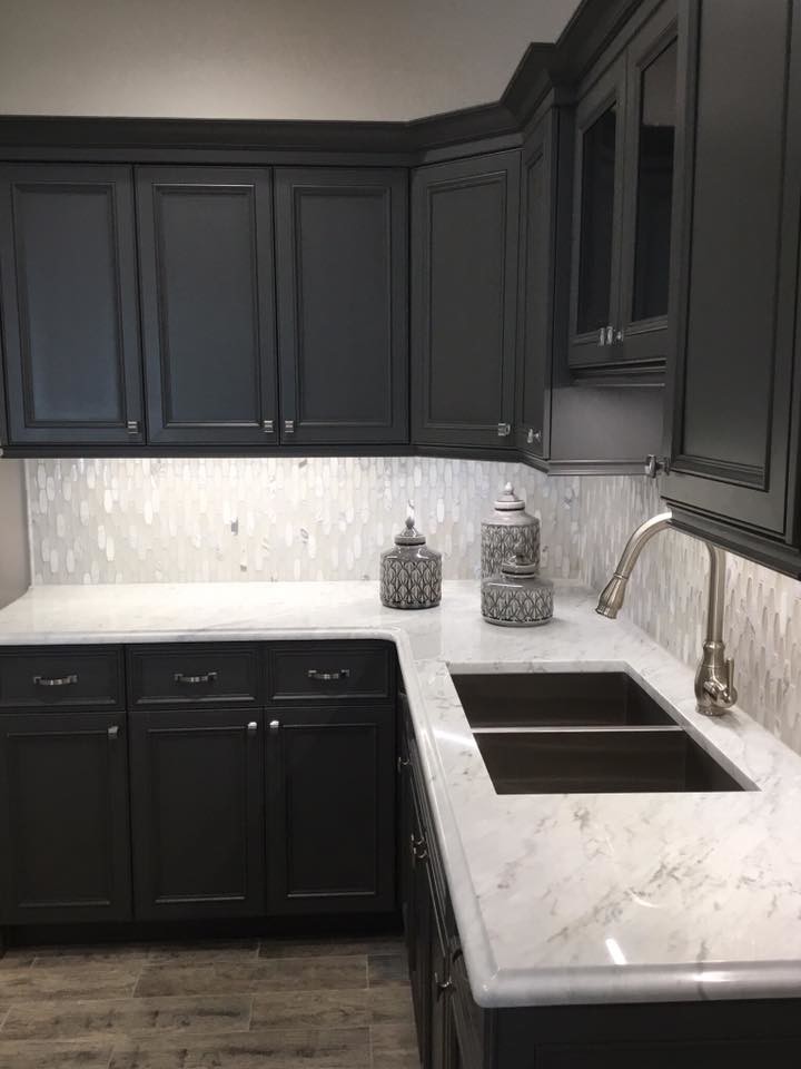 Contemporary kitchen in Atlanta with a submerged sink, beaded cabinets, grey cabinets, marble worktops, grey splashback, marble splashback, vinyl flooring and brown floors.