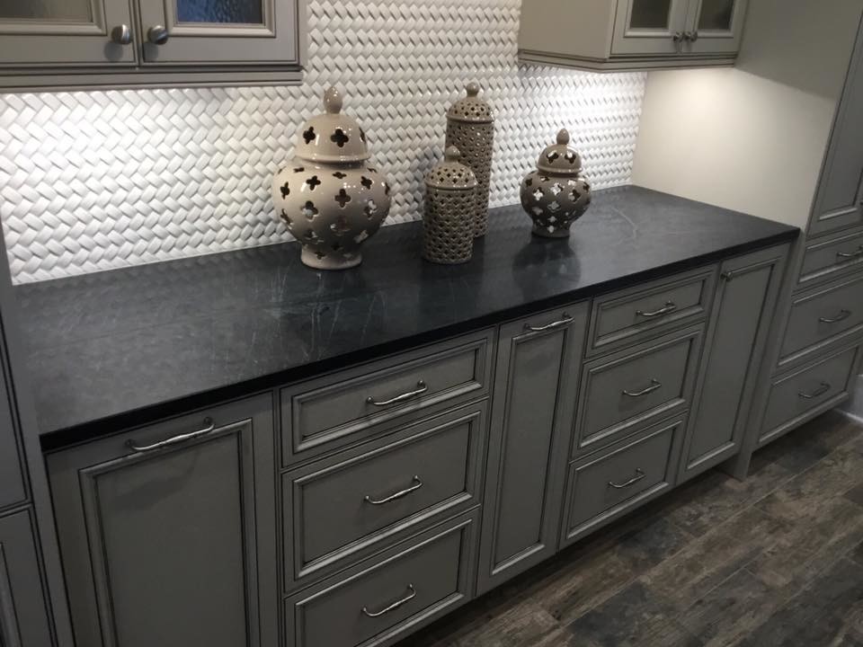 Inspiration for a transitional dark wood floor and brown floor kitchen remodel in Atlanta with beaded inset cabinets, gray cabinets, soapstone countertops and white backsplash