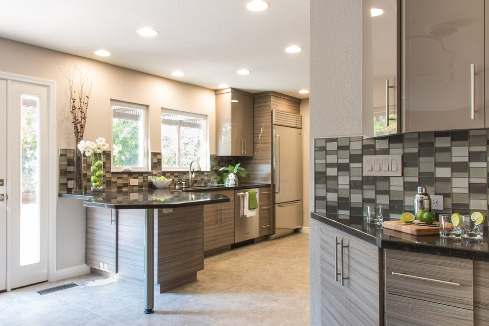 Trendy galley linoleum floor eat-in kitchen photo in San Francisco with an undermount sink, flat-panel cabinets, gray cabinets, quartz countertops, gray backsplash, stainless steel appliances and glass tile backsplash