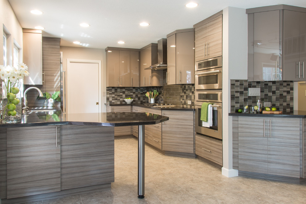 Example of a mid-sized trendy galley linoleum floor eat-in kitchen design in San Francisco with flat-panel cabinets, quartz countertops, glass tile backsplash, stainless steel appliances, an undermount sink, gray cabinets and gray backsplash