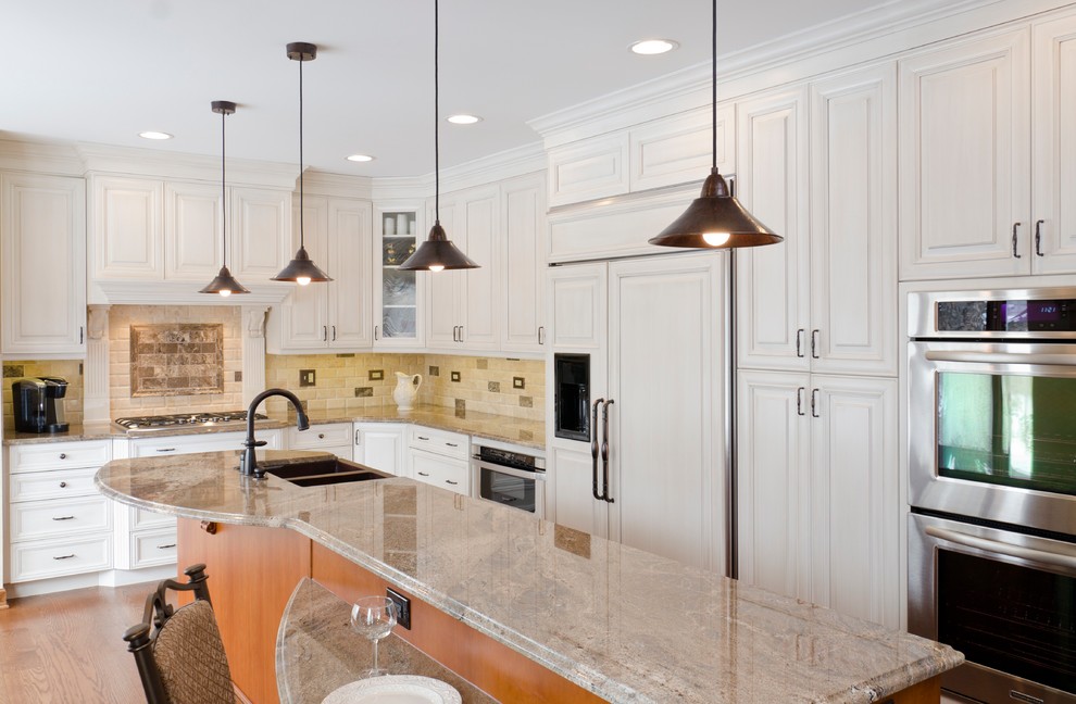 Enclosed kitchen - modern l-shaped enclosed kitchen idea in Chicago with a double-bowl sink, raised-panel cabinets, white cabinets, granite countertops, multicolored backsplash, ceramic backsplash and stainless steel appliances
