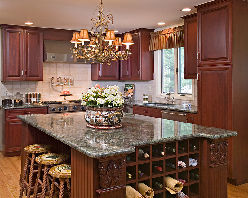Large tuscan l-shaped medium tone wood floor and brown floor eat-in kitchen photo in Philadelphia with a single-bowl sink, raised-panel cabinets, dark wood cabinets, granite countertops, black backsplash, stainless steel appliances and an island
