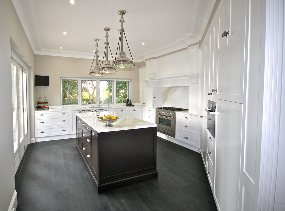 Inspiration for a large transitional u-shaped dark wood floor eat-in kitchen remodel in Sydney with an undermount sink, shaker cabinets, white cabinets, marble countertops, white backsplash, stone slab backsplash, stainless steel appliances and an island