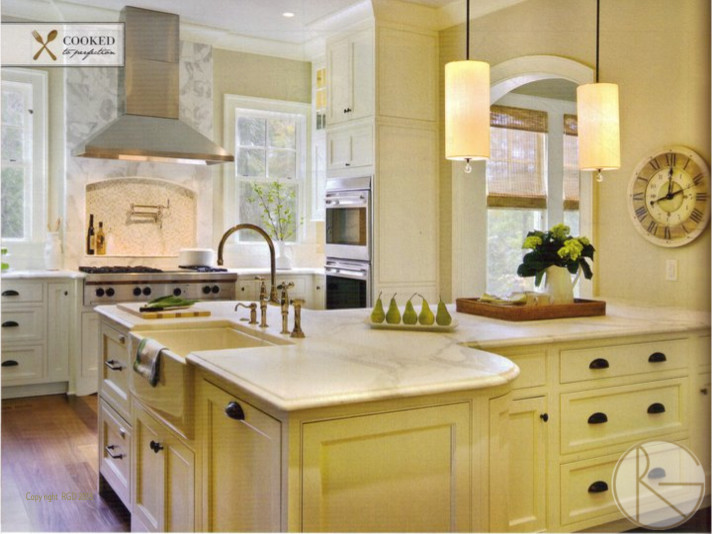 Inspiration for a traditional kitchen in Charleston with a belfast sink, beaded cabinets, white cabinets, marble worktops, white splashback, stone tiled splashback, stainless steel appliances, medium hardwood flooring and an island.