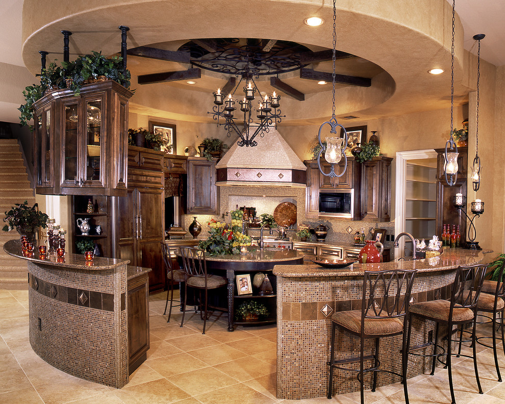 Example of a tuscan u-shaped ceramic tile enclosed kitchen design in Austin with a double-bowl sink, raised-panel cabinets, brown cabinets, granite countertops, beige backsplash, paneled appliances and an island