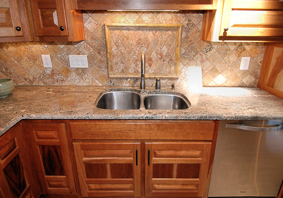 Mid-sized arts and crafts l-shaped kitchen photo in Portland with an undermount sink, raised-panel cabinets, medium tone wood cabinets and granite countertops