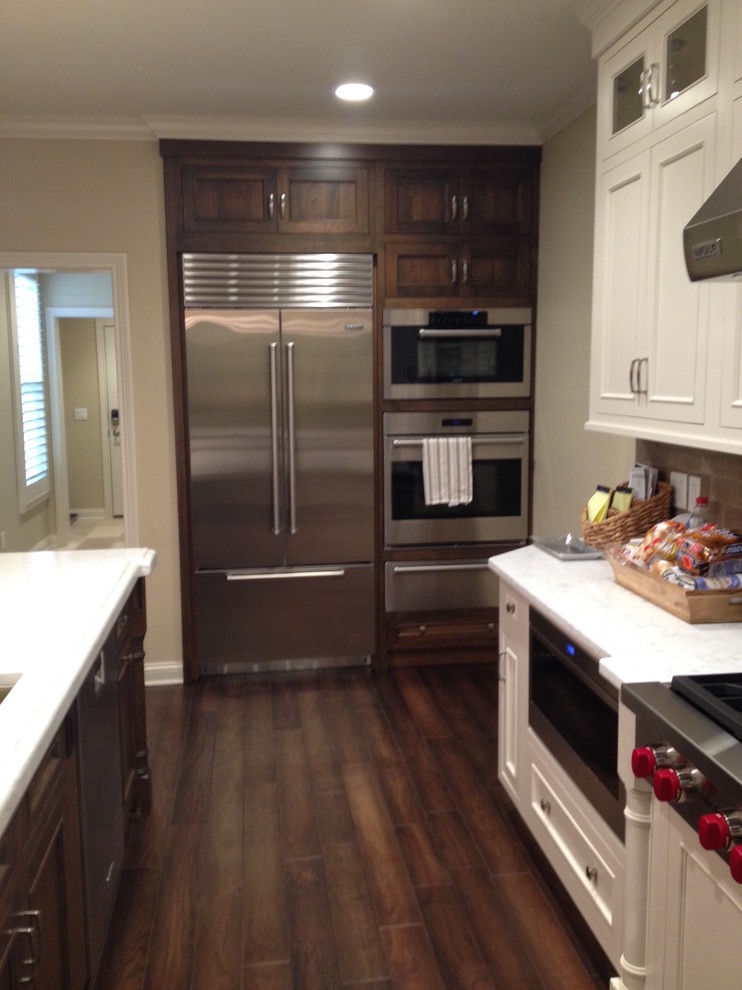 Large contemporary kitchen in Other with stainless steel appliances.