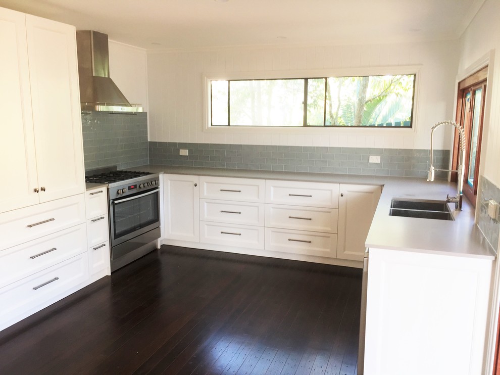 Example of a transitional kitchen design in Brisbane
