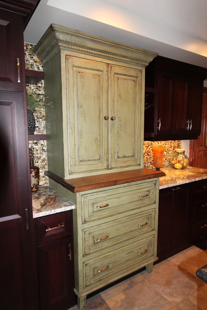 Example of a large classic ceramic tile kitchen design in Other with raised-panel cabinets, green cabinets, granite countertops, multicolored backsplash, matchstick tile backsplash and an island