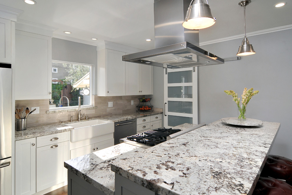 Example of a large transitional galley dark wood floor eat-in kitchen design in San Francisco with a farmhouse sink, shaker cabinets, white cabinets, granite countertops, beige backsplash, ceramic backsplash, stainless steel appliances and an island