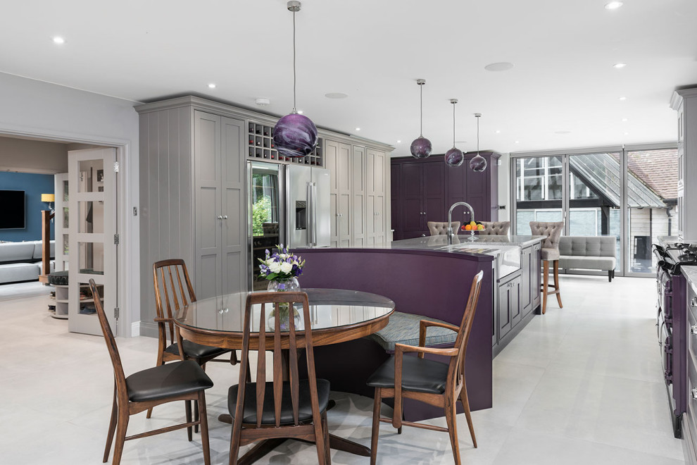 Inspiration for a traditional grey and purple galley kitchen in Berkshire with a belfast sink, shaker cabinets, grey cabinets, stainless steel appliances, an island, grey floors and grey worktops.
