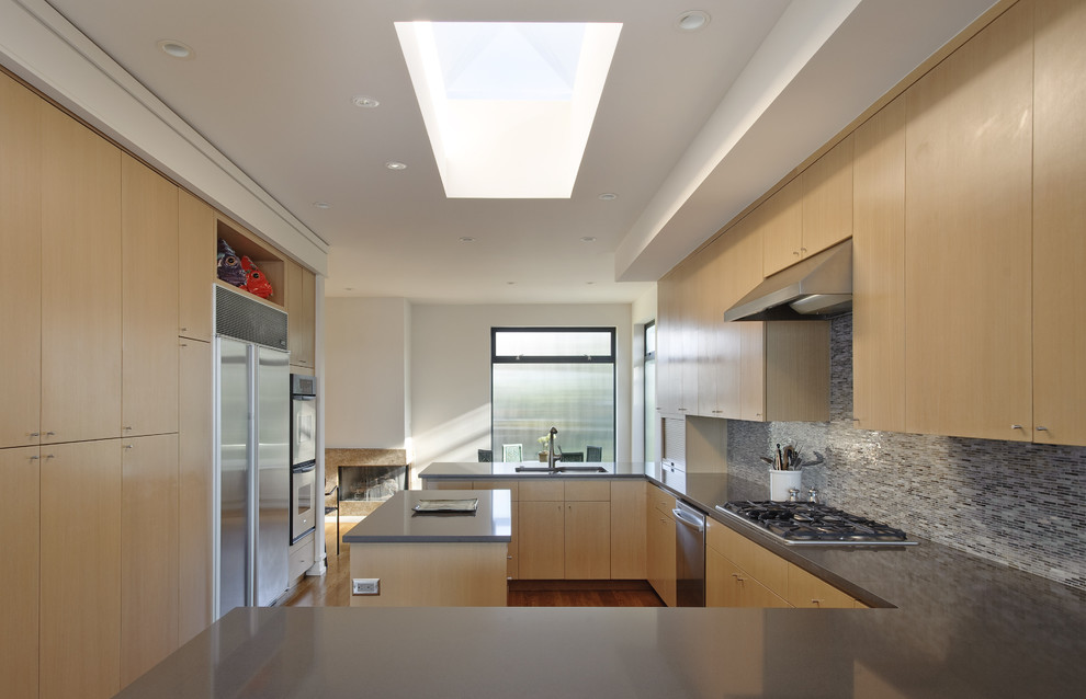 This is an example of a contemporary kitchen in Seattle with stainless steel appliances.