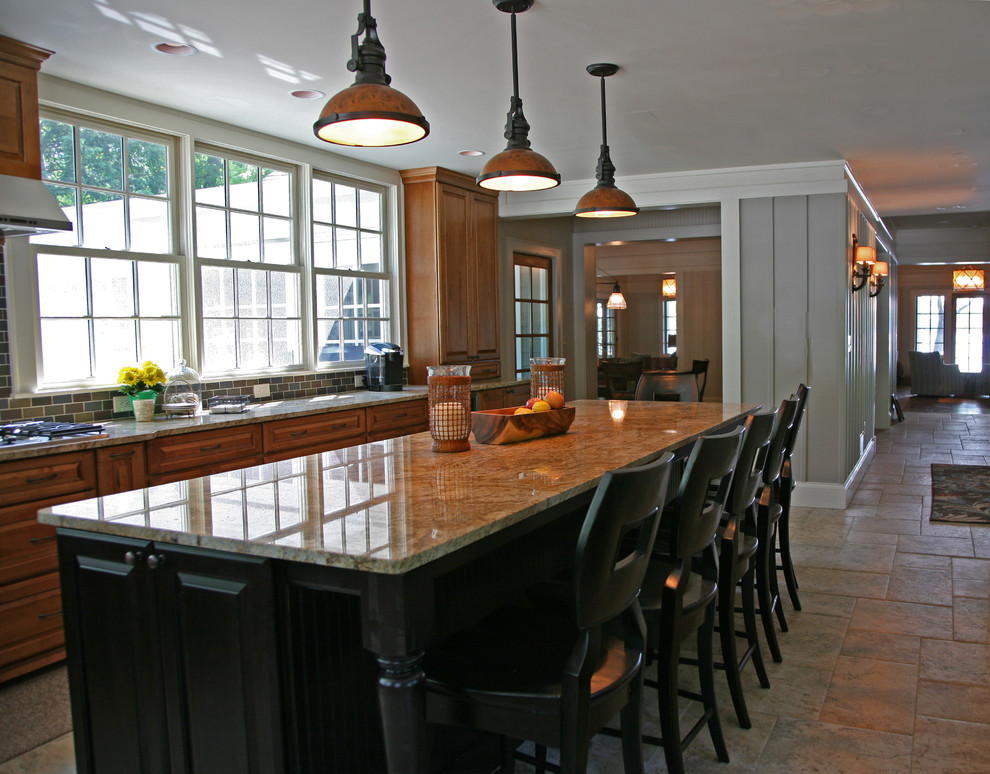 This is an example of a traditional kitchen in Milwaukee with an island.