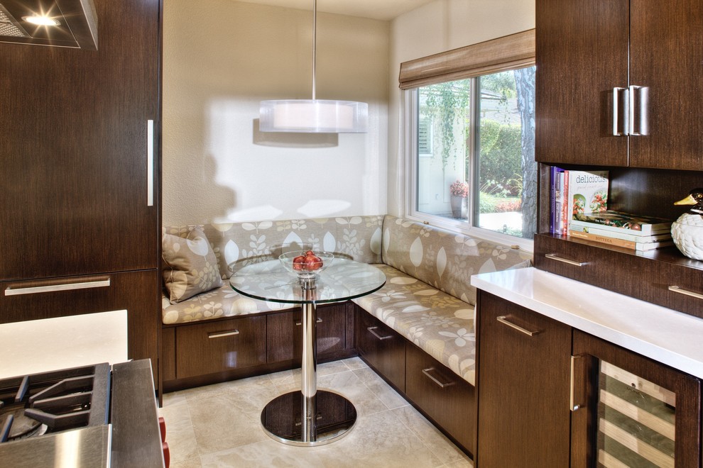 This is an example of a large contemporary l-shaped kitchen/diner in Sacramento with a submerged sink, recessed-panel cabinets, white cabinets, marble worktops, beige splashback, cement tile splashback, stainless steel appliances, medium hardwood flooring and a breakfast bar.