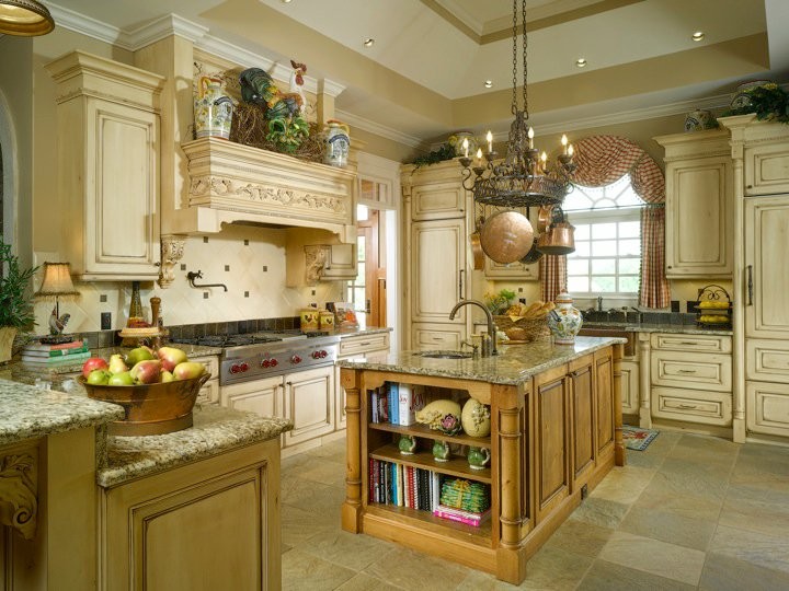 Example of a large ornate l-shaped cement tile floor and multicolored floor eat-in kitchen design in Atlanta with a drop-in sink, raised-panel cabinets, beige cabinets, granite countertops, beige backsplash, ceramic backsplash, stainless steel appliances and an island