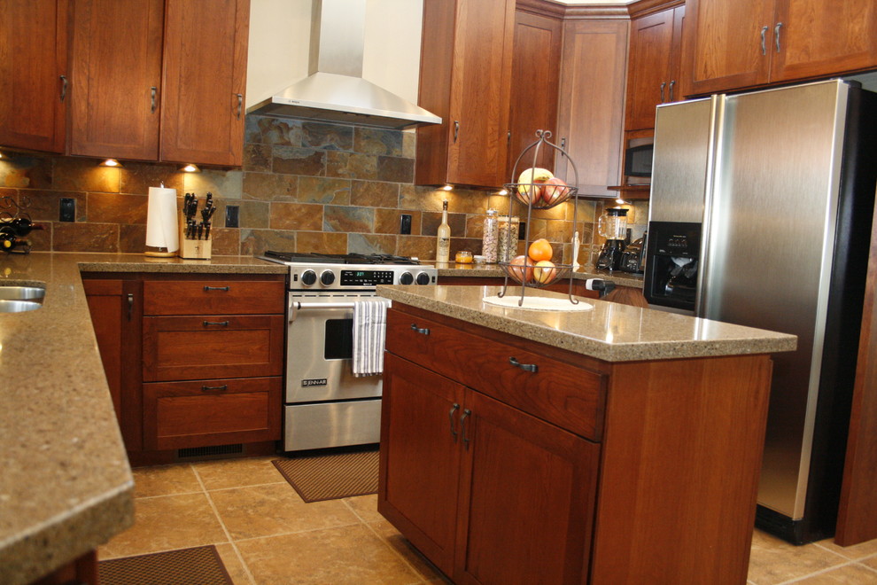 This is an example of a medium sized traditional u-shaped kitchen/diner in Sacramento with a double-bowl sink, shaker cabinets, medium wood cabinets, engineered stone countertops, multi-coloured splashback, stone tiled splashback, stainless steel appliances, ceramic flooring and an island.