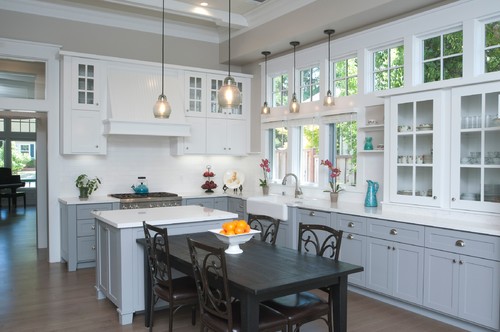 Bright kitchen interior featuring the quality of Canadian RTA cabinets in white and grey tones with glass doors