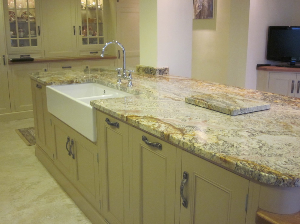 Inspiration for a timeless eat-in kitchen remodel in Manchester with granite countertops