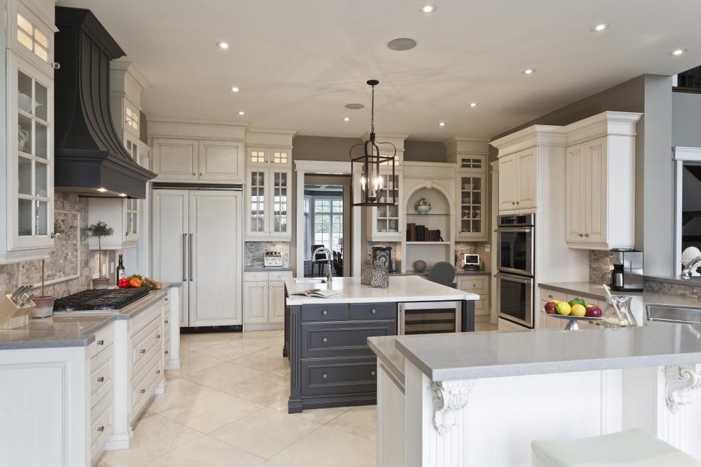 Inspiration for a huge timeless u-shaped ceramic tile eat-in kitchen remodel in DC Metro with a double-bowl sink, raised-panel cabinets, white cabinets, granite countertops, multicolored backsplash, ceramic backsplash, stainless steel appliances and two islands