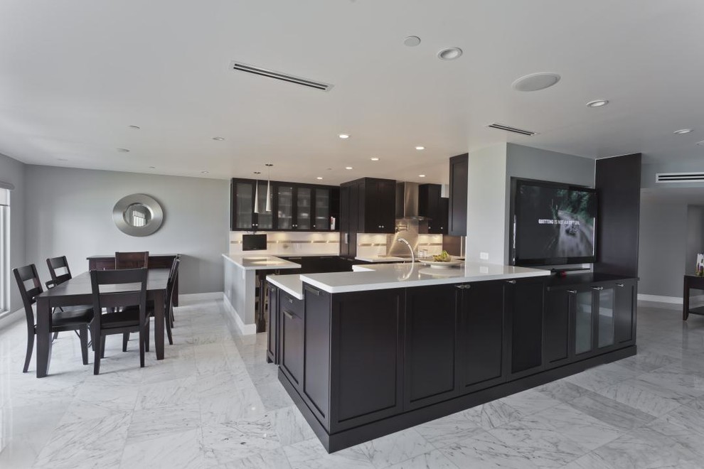 Example of a huge transitional u-shaped ceramic tile eat-in kitchen design in DC Metro with a single-bowl sink, shaker cabinets, dark wood cabinets, quartzite countertops, white backsplash, ceramic backsplash, stainless steel appliances and two islands