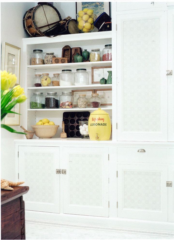 Kitchen pantry - small traditional single-wall kitchen pantry idea in Los Angeles with beaded inset cabinets, white cabinets, wood countertops, white backsplash and no island