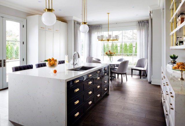Inspiration for a mid-sized contemporary eat-in kitchen remodel in New York with flat-panel cabinets, white cabinets, stainless steel appliances and an island