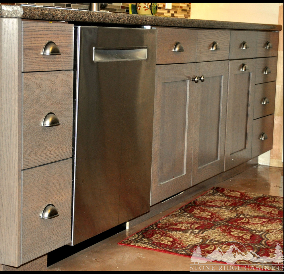 Example of a mid-sized classic l-shaped concrete floor eat-in kitchen design in Salt Lake City with an island, flat-panel cabinets, gray cabinets and granite countertops