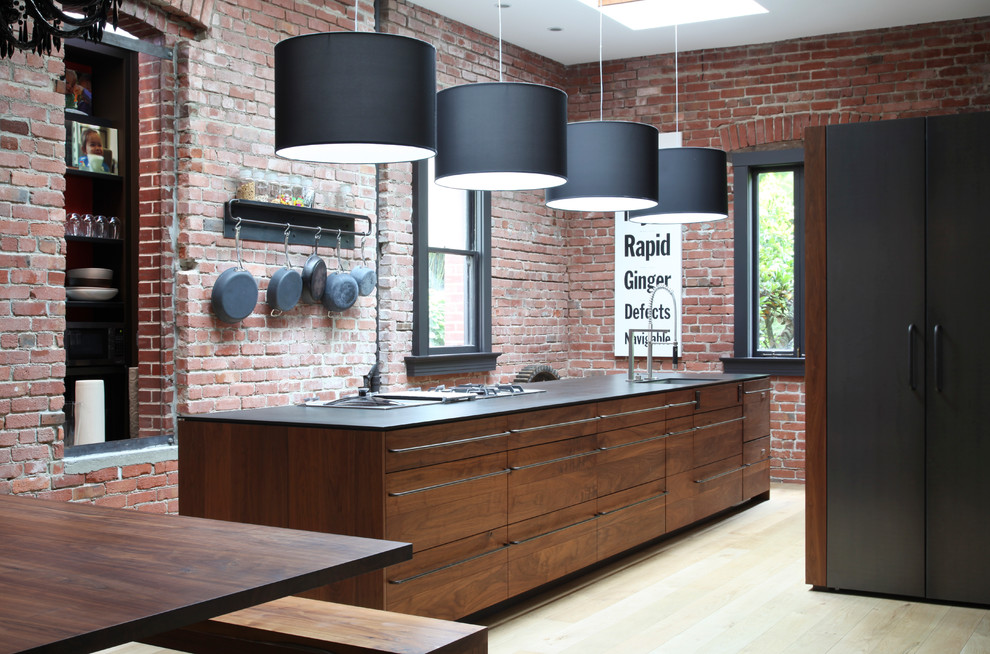 Kitchen - contemporary galley kitchen idea in San Francisco with an undermount sink, flat-panel cabinets and medium tone wood cabinets