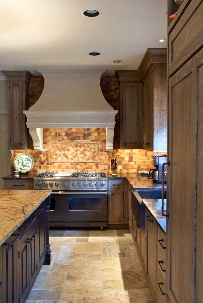 Rustic u-shaped kitchen/diner in Other with a belfast sink, recessed-panel cabinets and distressed cabinets.