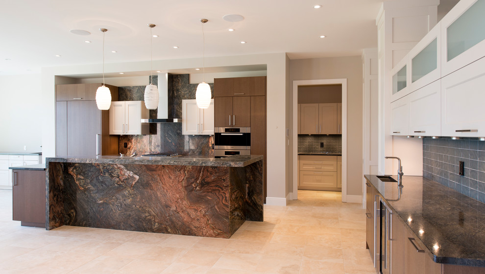 Inspiration for an expansive classic l-shaped open plan kitchen in Edmonton with a submerged sink, flat-panel cabinets, dark wood cabinets, granite worktops, grey splashback, stone tiled splashback, stainless steel appliances, porcelain flooring, an island and beige floors.