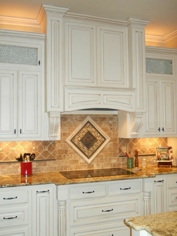 Large tuscan galley ceramic tile eat-in kitchen photo in Dallas with an undermount sink, raised-panel cabinets, distressed cabinets, granite countertops, multicolored backsplash, stone tile backsplash and stainless steel appliances