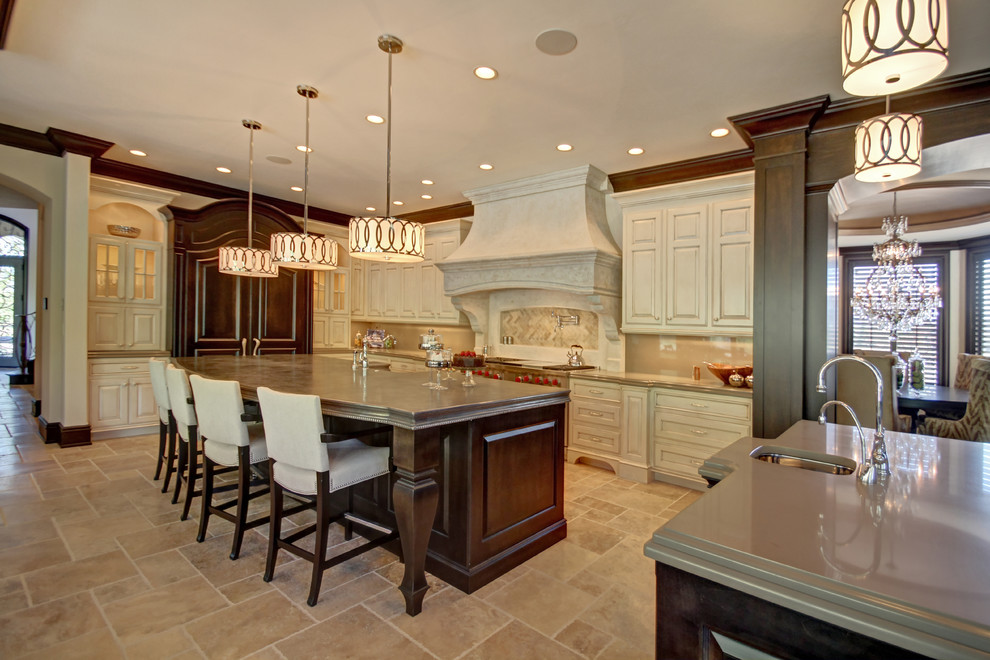 Eat-in kitchen - traditional eat-in kitchen idea in Boise with raised-panel cabinets, beige cabinets and gray backsplash