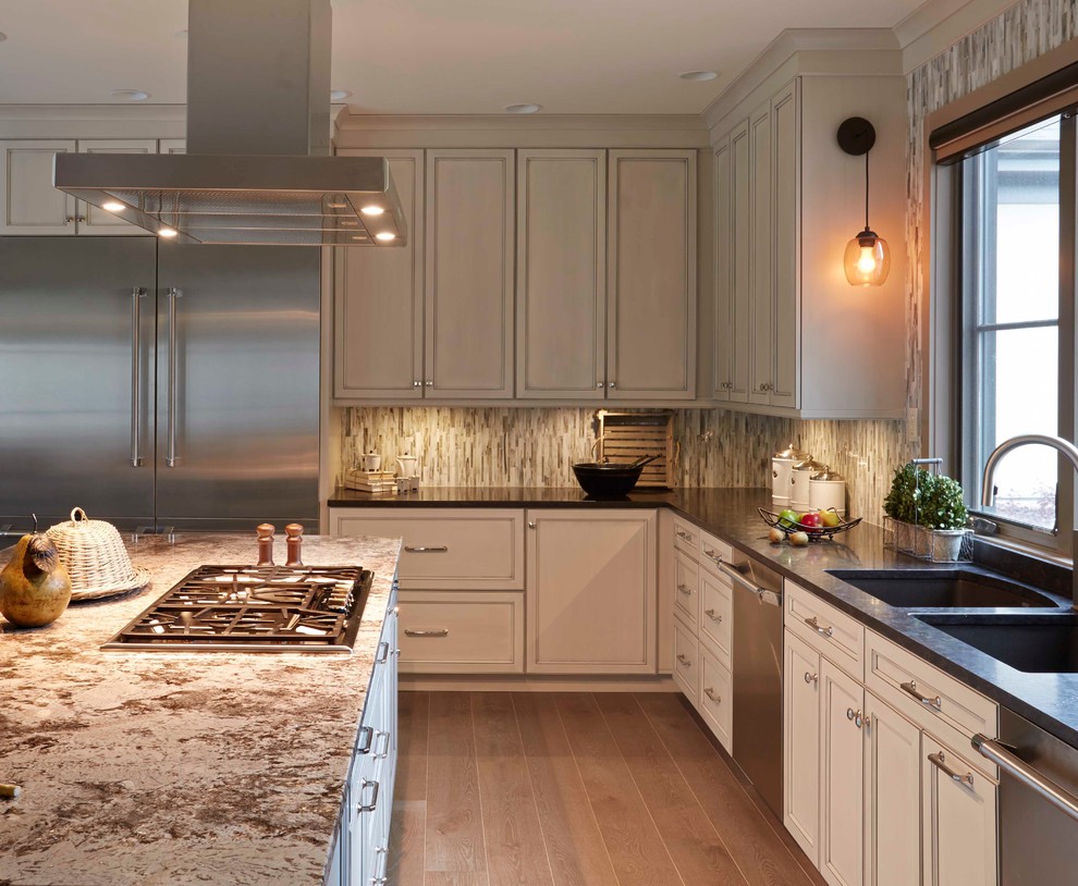 Inspiration for a large transitional u-shaped porcelain tile eat-in kitchen remodel in Boston with a double-bowl sink, recessed-panel cabinets, gray cabinets, laminate countertops, gray backsplash, mosaic tile backsplash, stainless steel appliances and an island