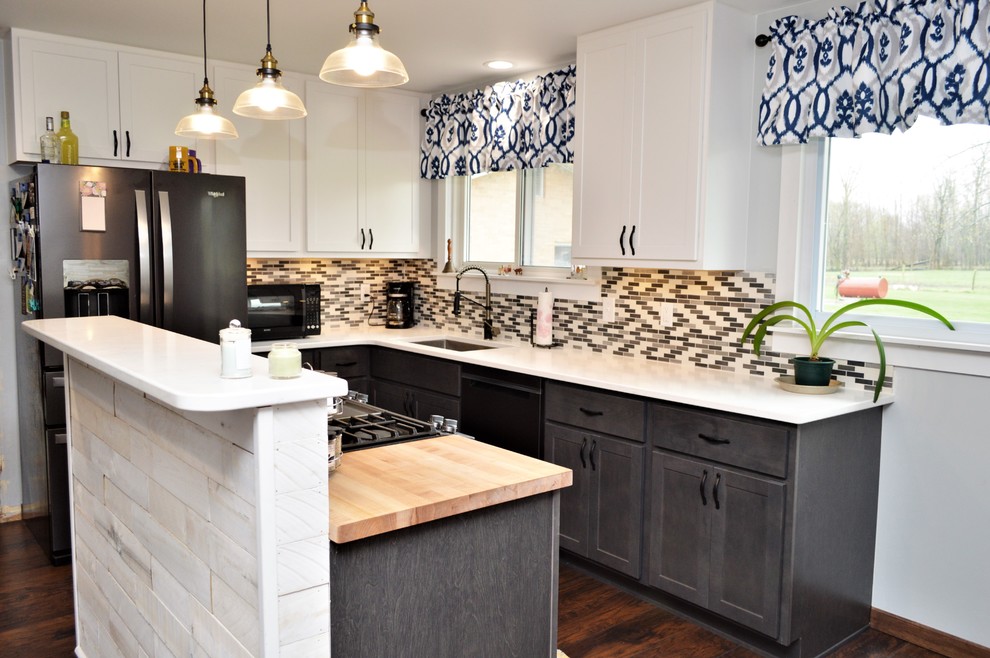 Eat-in kitchen - mid-sized country l-shaped dark wood floor and brown floor eat-in kitchen idea in Other with an undermount sink, shaker cabinets, gray cabinets, quartzite countertops, multicolored backsplash, black appliances, an island and white countertops