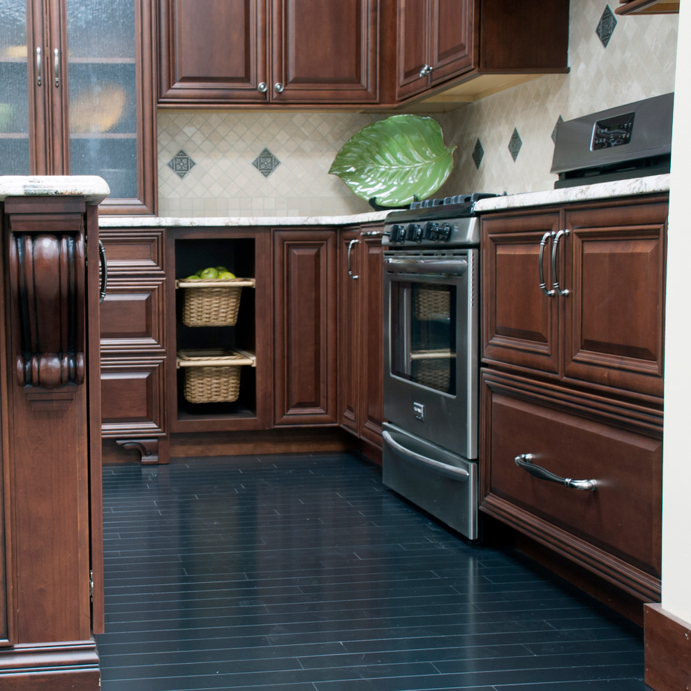 Classic kitchen in New York with a submerged sink, raised-panel cabinets, medium wood cabinets, granite worktops, beige splashback, ceramic splashback, stainless steel appliances, dark hardwood flooring and an island.