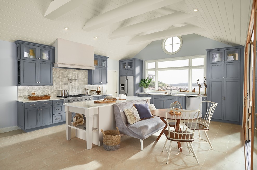 Inspiration for a large nautical l-shaped kitchen/diner in Birmingham with a submerged sink, recessed-panel cabinets, quartz worktops, grey splashback, stone tiled splashback, stainless steel appliances, cement flooring, an island, beige floors, white worktops and grey cabinets.