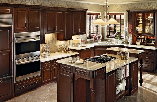 Photo of a large classic enclosed kitchen in Other with glass-front cabinets and an island.