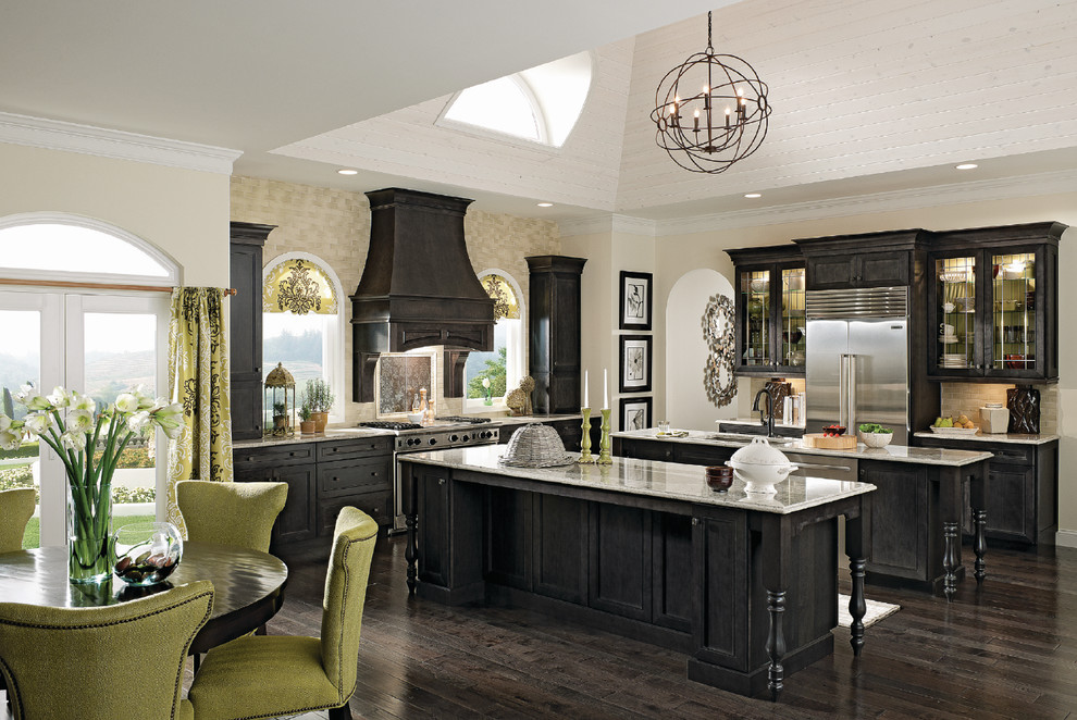 Example of a large transitional l-shaped dark wood floor and brown floor eat-in kitchen design in Richmond with an undermount sink, shaker cabinets, black cabinets, granite countertops, beige backsplash, stainless steel appliances and two islands