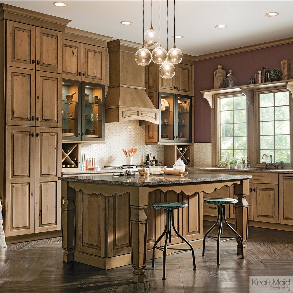 Eat-in kitchen - mid-sized rustic l-shaped eat-in kitchen idea in Detroit with raised-panel cabinets, light wood cabinets, beige backsplash and an island