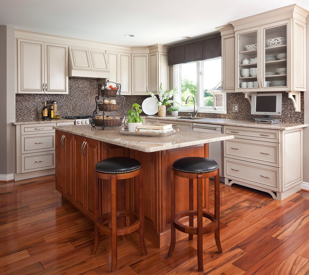 Transitional u-shaped light wood floor eat-in kitchen photo in Other with an undermount sink, beige cabinets, multicolored backsplash, mosaic tile backsplash, stainless steel appliances, quartz countertops and an island