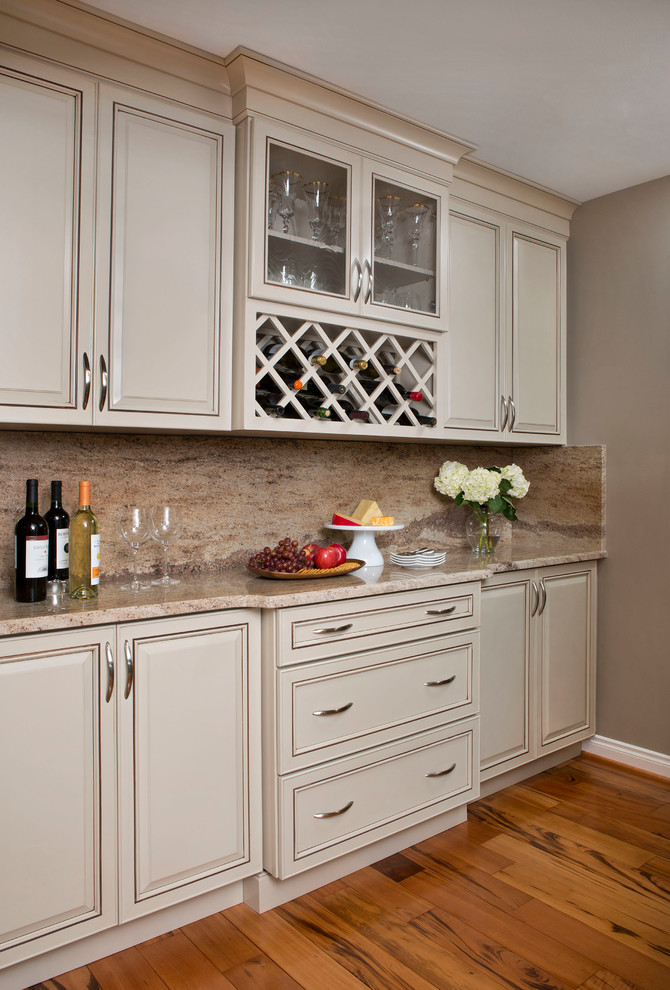 Transitional u-shaped eat-in kitchen photo in Other with an undermount sink, beige backsplash, stone slab backsplash and stainless steel appliances